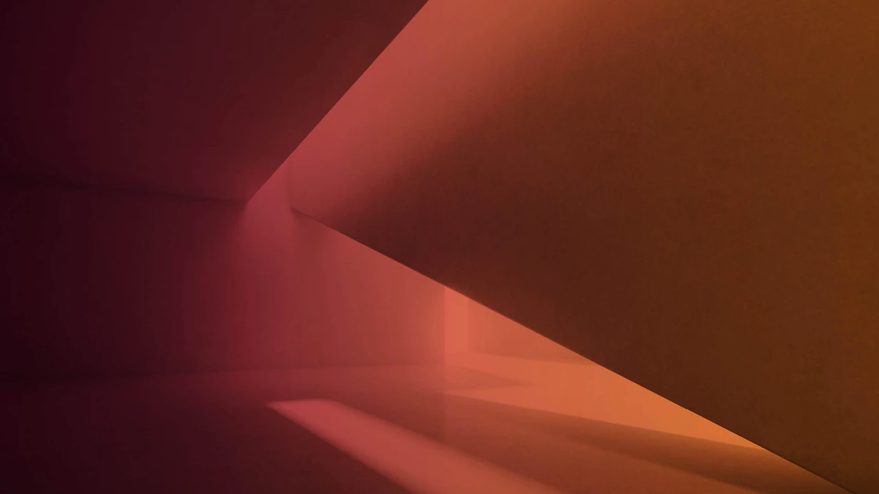 Two mint chocolate milkshakes with whipped cream and green sprinkles.