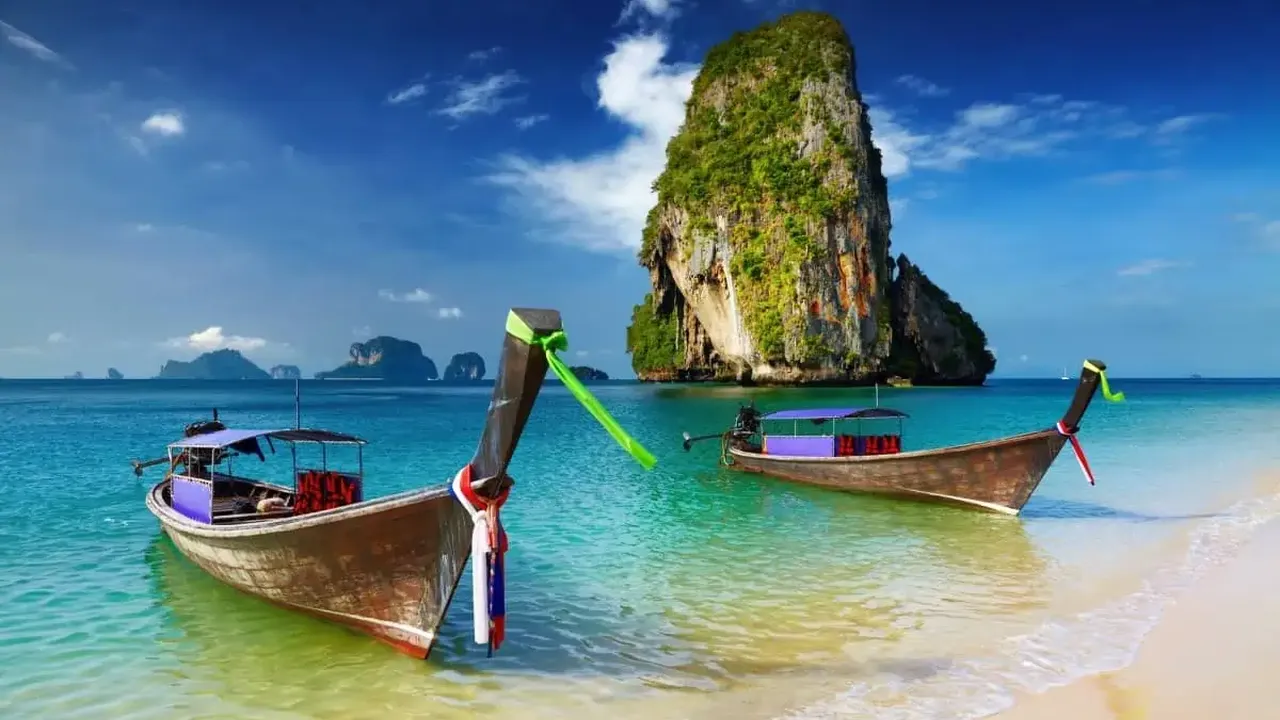 Close up on a plate of mashed potatoes, topped with baked pork chops with cream of mushroom soup, and a side of green beans.