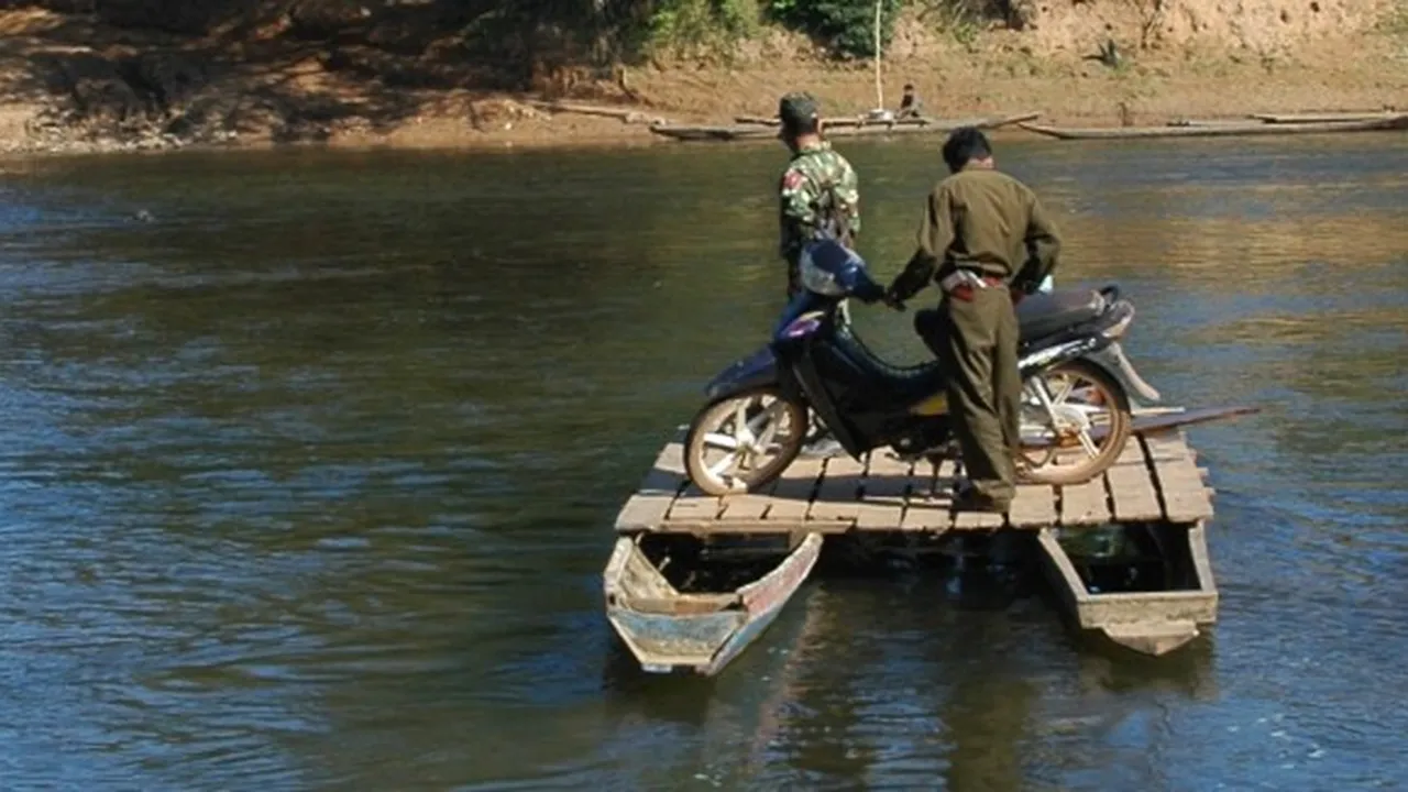 Close up on a plate of mashed potatoes, topped with baked pork chops with cream of mushroom soup, and a side of green beans.