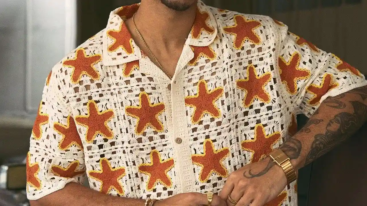 Two mint chocolate milkshakes with whipped cream and green sprinkles.